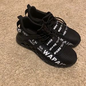 Size 8 in woman’s . Black and white